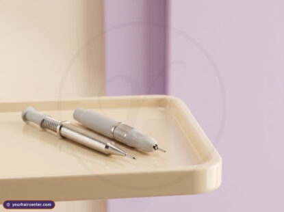 DHI vs FUE tools side by side on a cream clinical tray, a Choi implanter pen and an FUE micro-punch handpiece