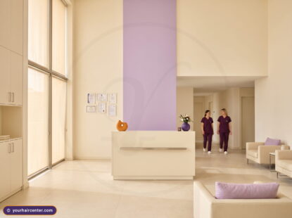 Reception of a verified Istanbul partner clinic for a beard transplant in Turkey, framed accreditation documents on a cream wall