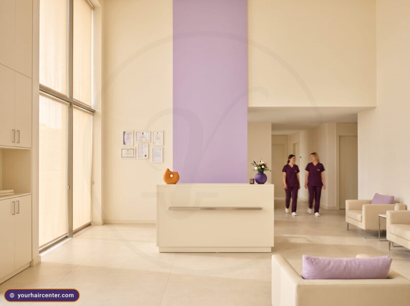 Reception of a verified Istanbul partner clinic for a beard transplant in Turkey, framed accreditation documents on a cream wall
